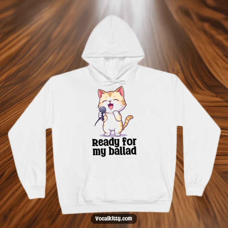 Funny hoodie showing a cat in a karaoke pose, gripping a microphone with gusto, offering warmth and humor.