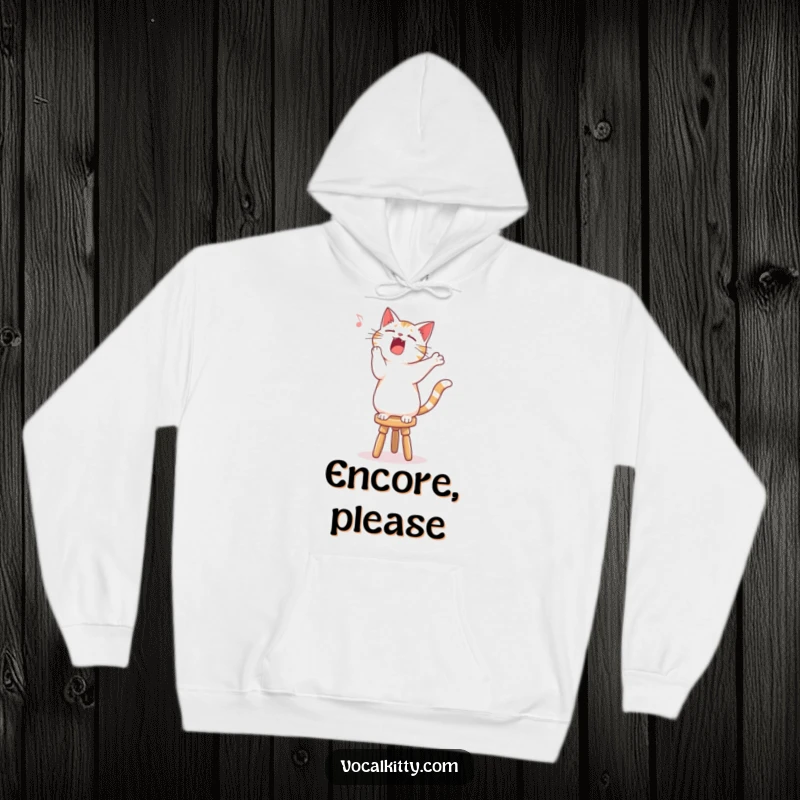 Funny singing cat hoodie, standing on a stool, belting out a song with expressive gusto.
