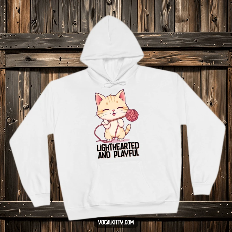 Funny Hoodie featuring a cat playfully batting at a floating soap bubble, embodying pure joy and fun.