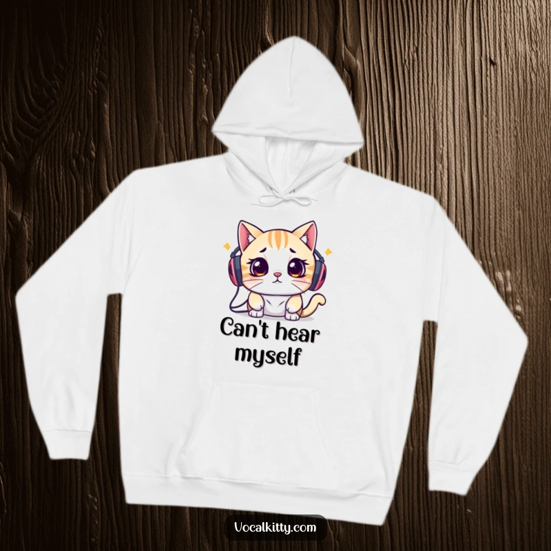 Funny hoodie showing a cat overwhelmed by sound from speakers on its head, perfect for introverts seeking comfort and quiet.