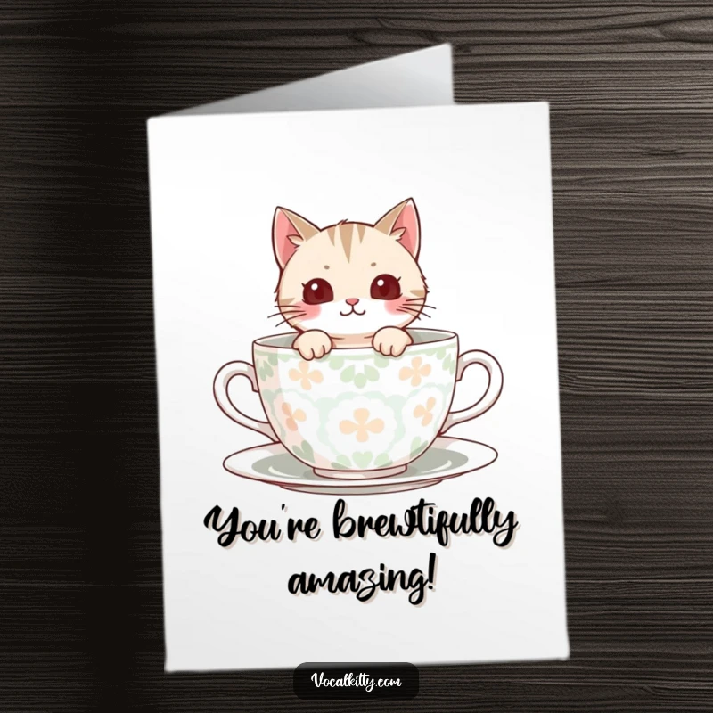 Funny Free Printable Congratulations Card: A cat peeks out from a large, decorative teacup, conveying happy news.