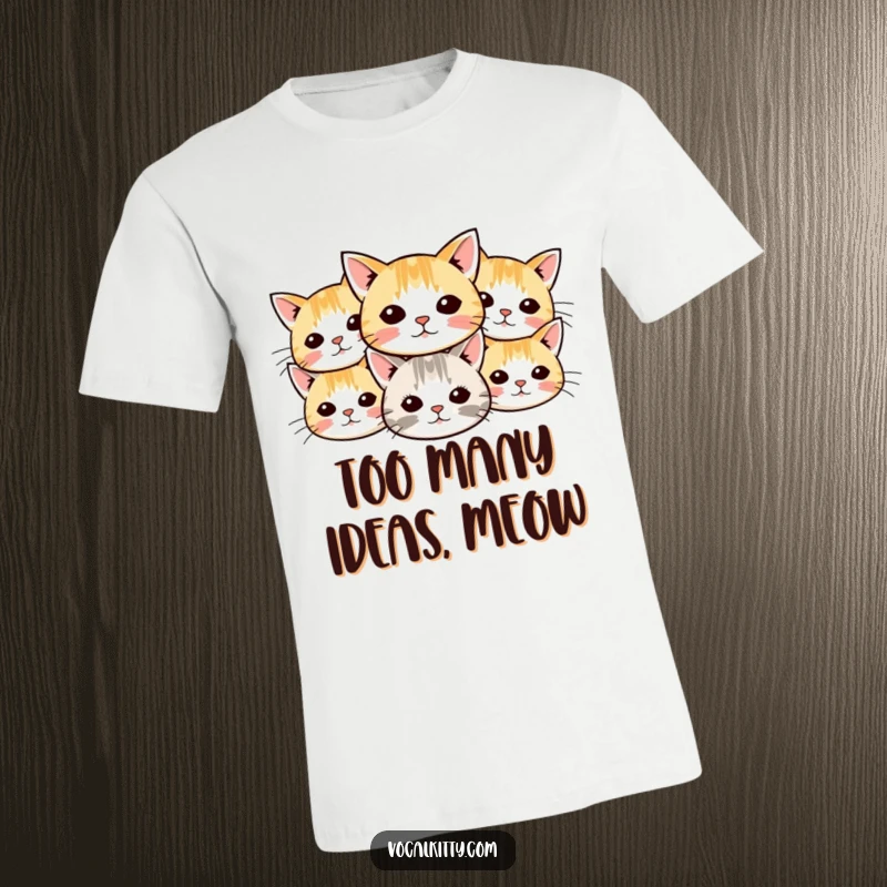 Funny cat t-shirt featuring a fun design of small cartoon cat heads with whiskers radiating outwards in a dynamic, cheerful display.