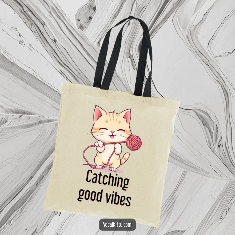Funny Tote Bag depicting a cat playfully batting at a shimmering soap bubble, brimful of joy.
