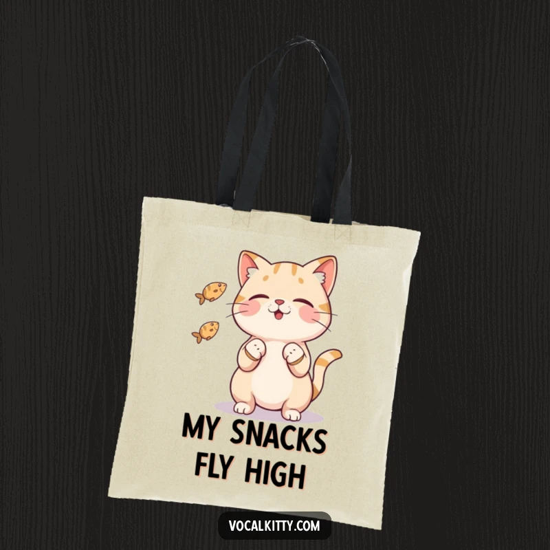 Funny cat tote bag depicting a feline character impressively juggling three tiny fish with its paws, a humorous and practical tote.