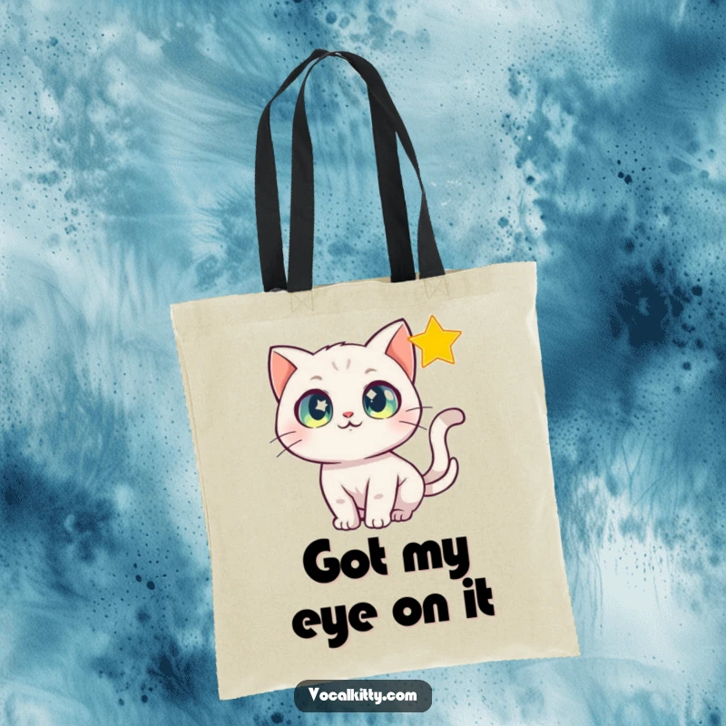Funny Tote Bag featuring a cat with wide, sparkling eyes chasing a bright, shimmering star.